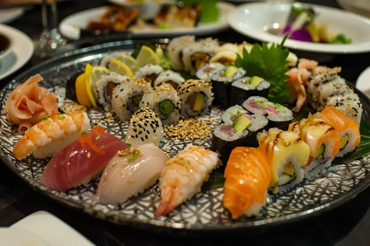 [A delicious plate of sushi] --9 salmon ---1