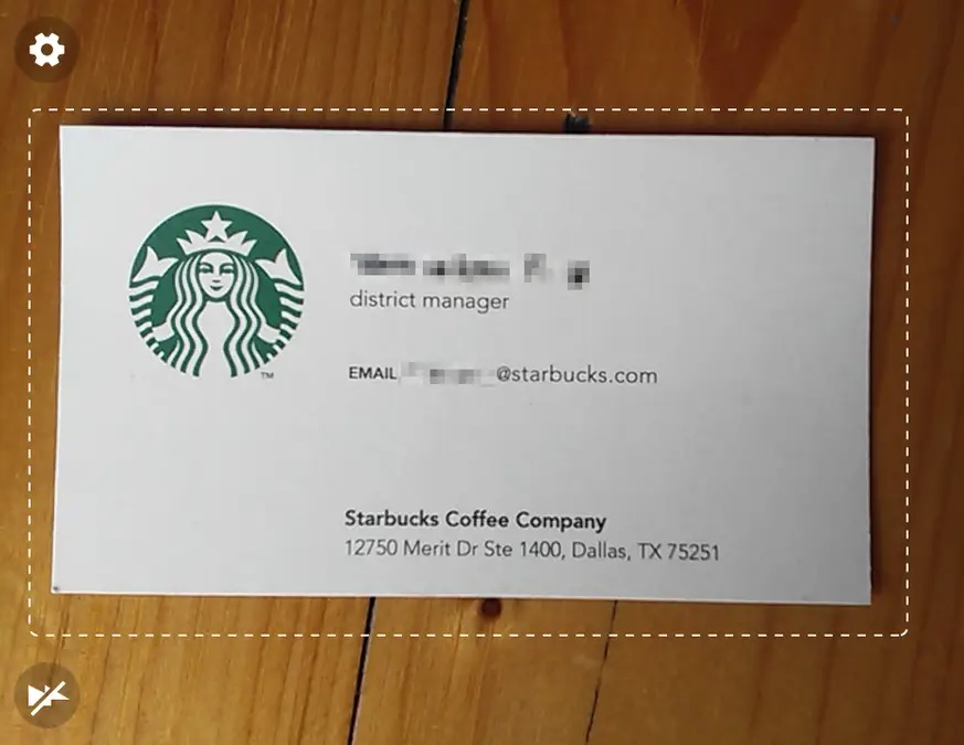 Business card scanner in action, scanning a Starbucks business card